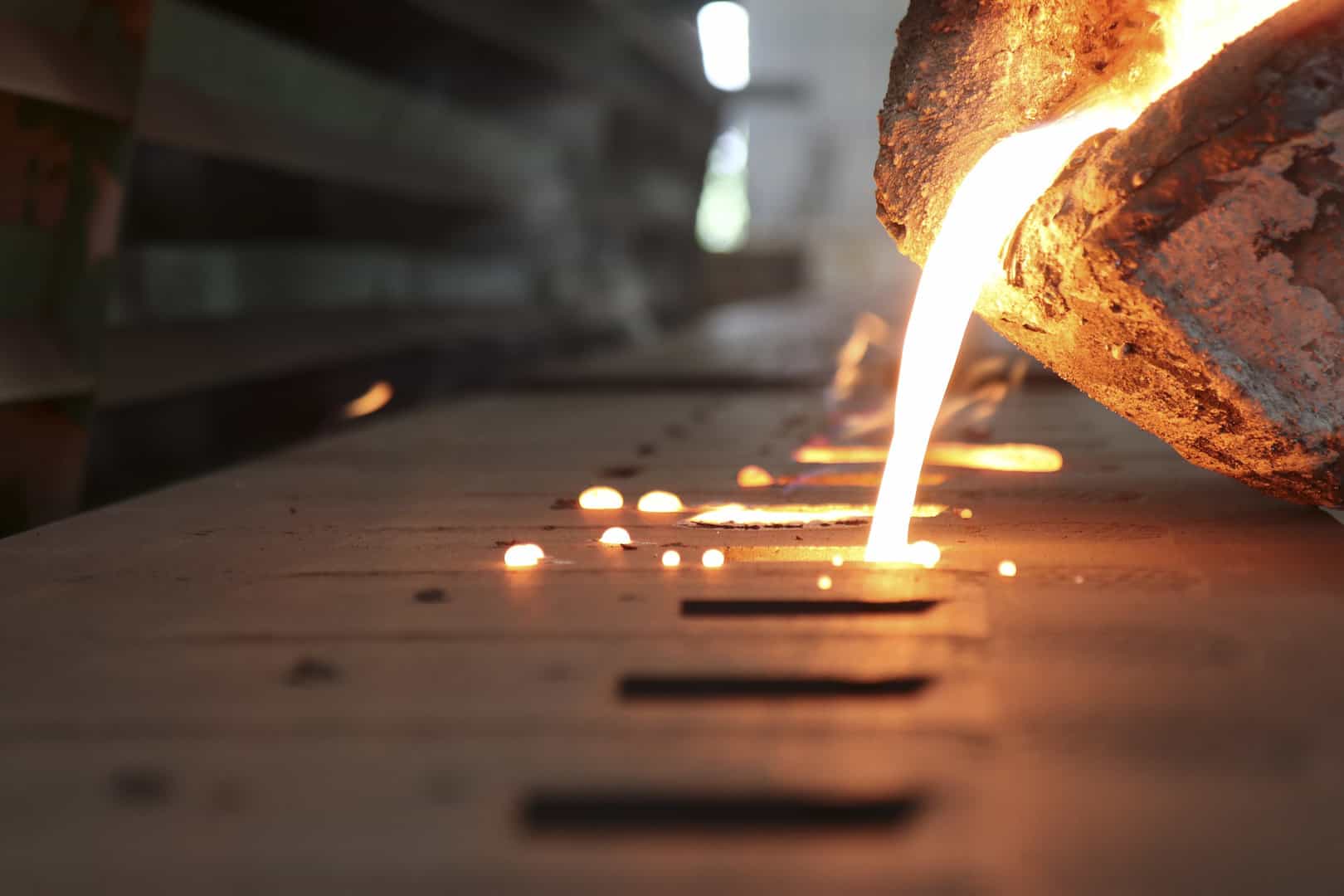 Pouring molten metal